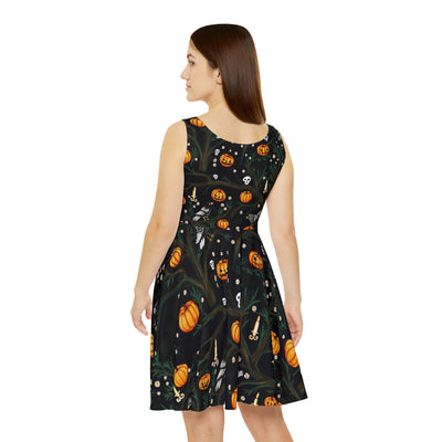 Halloween pattern featuring cute crows, skulls, bats, pumpkins, a few spiders, and some creepy tree branches, on a dress, black background