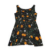 Halloween pattern featuring cute crows, skulls, bats, pumpkins, a few spiders, and some creepy tree branches, on a dress, black background